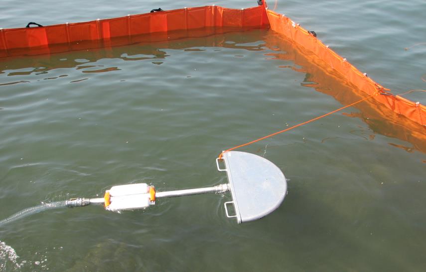 Vampire Oil Skimmer working inside an oil boom on the water surface - floating suction head